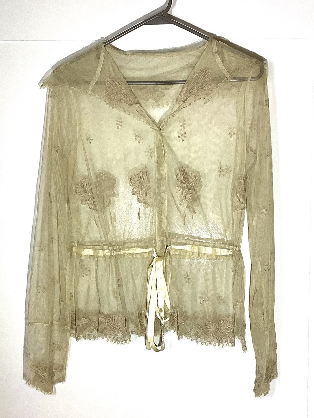 Sheer ecru blouse of mesh netting with floral needlework